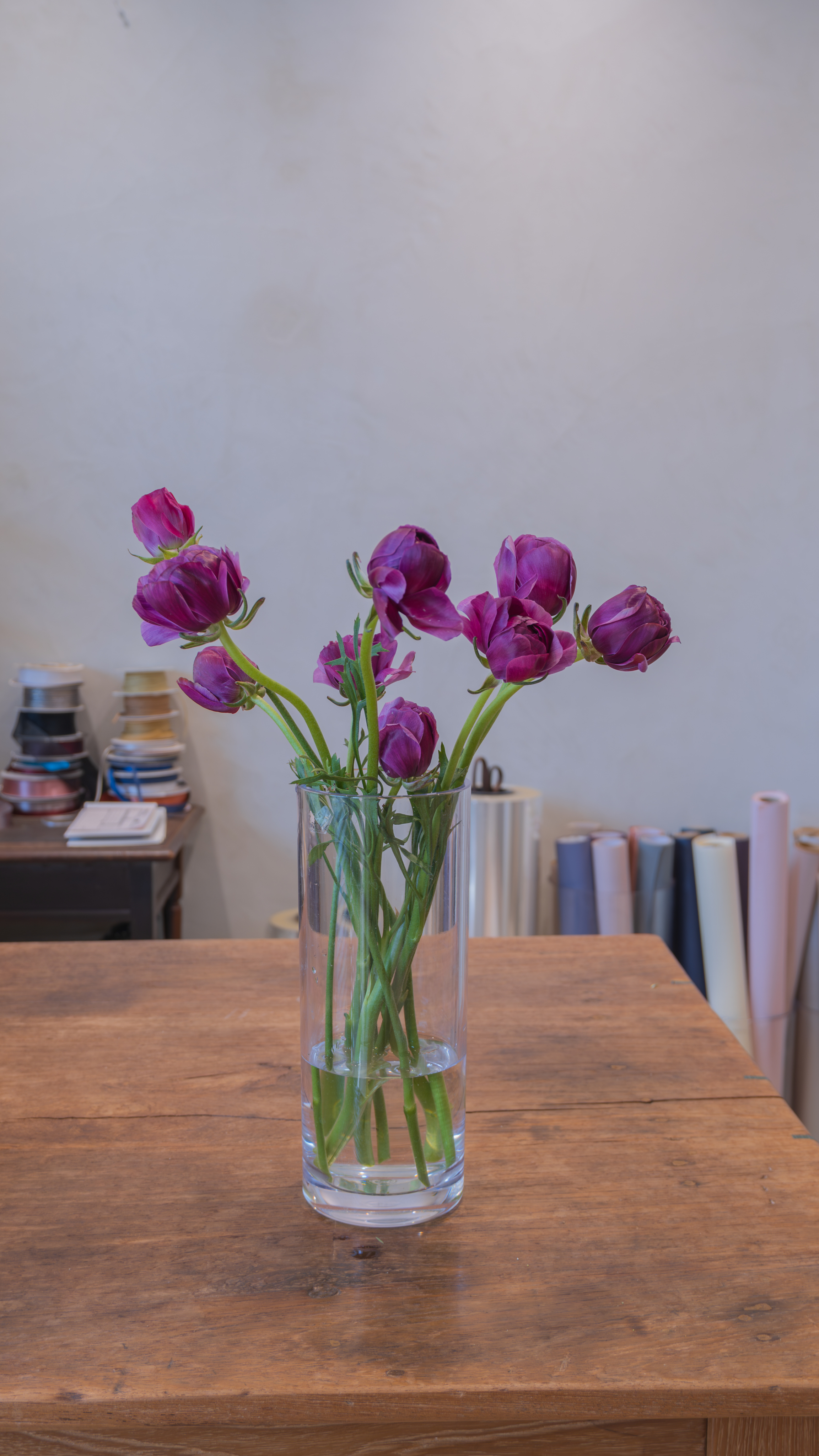 Hand holding mixed flowers bouquet