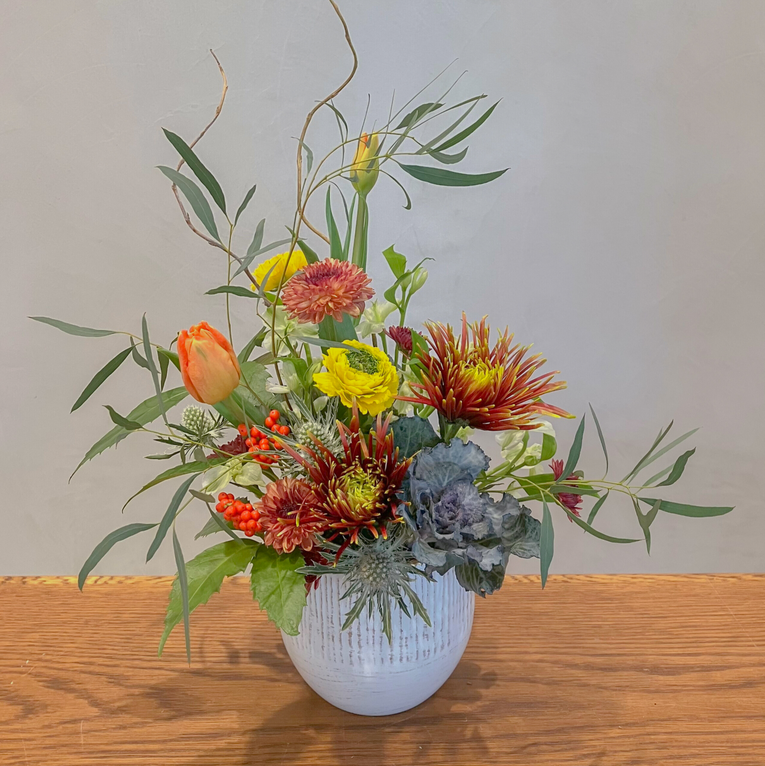 Orange and peach flowers in vase